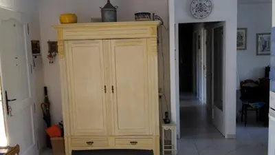 a large wooden cabinet in a living room at Provence Vaucluse Ventoux Villa Caromb in Caromb