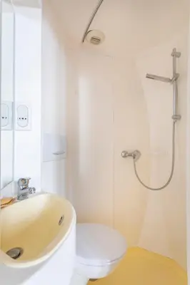 a bathroom with a sink and a toilet and a shower at Studio calme et lumineux in Aix-en-Provence