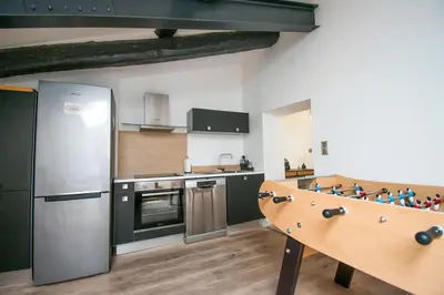 a kitchen with a pool table in the middle of it at Moderne et lumineux - clim - wifi in Aix-en-Provence