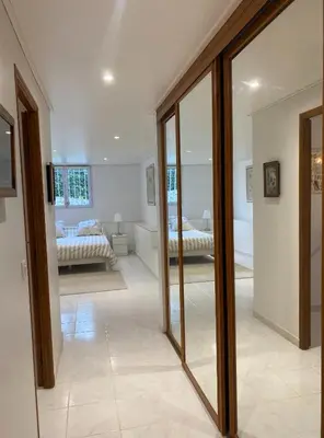 a living room with a view of a bedroom at T3 avec jardin et piscine privée in Velaux
