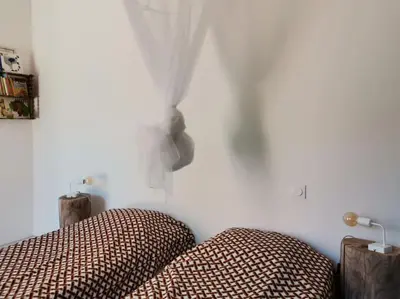 a bedroom with two beds and a white wall at Luberon : maison près de Joucas et Gordes in Joucas