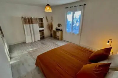 a bedroom with a large bed in a room at Soleil d’ocre - Bastide à Roussillon in Roussillon