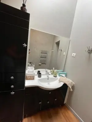 a bathroom with a sink and a large mirror at LA BASTIDE FERREOL in La Motte-dʼAigues