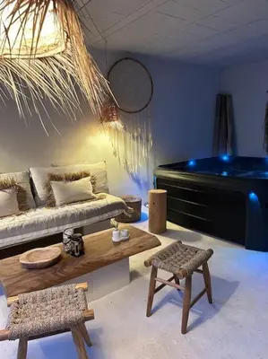 a living room with a couch and a piano at Superbe maison avec jacuzzi in Ventabren