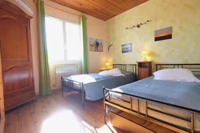 a bedroom with two beds and a window at pretty detached villa with private swimming pool, in Aureille, in the alpilles - 8 people in Aureille