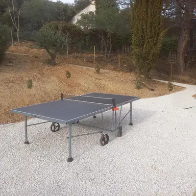 a ping pong table sitting on the ground at LOU BRISOU in Saint-Saturnin-les-Apt