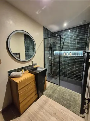 a bathroom with a sink and a shower with a mirror at Le Cocoon - Jacuzzi, Sauna et Piscine privée in Carpentras