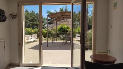 an open door with a view of a patio at Location au cœur du Luberon 2 personnes in Saint-Saturnin-les-Apt