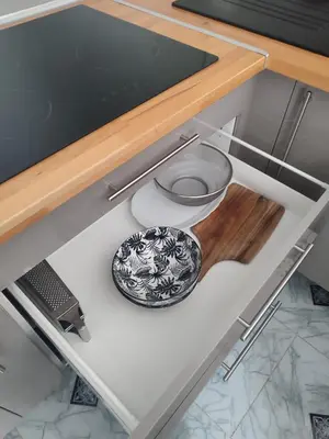 a drawer with a bowl on it in a kitchen at Studio Zen Miramas in Miramas