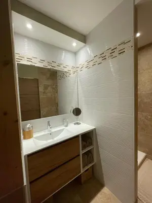 a bathroom with a sink and a mirror at En Provence chez Valérie in Cavaillon