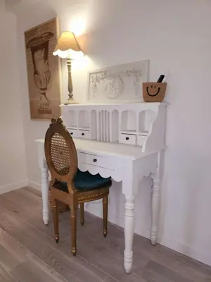 a white desk with a chair and a lamp at Le Clos Renaissance in Oppède