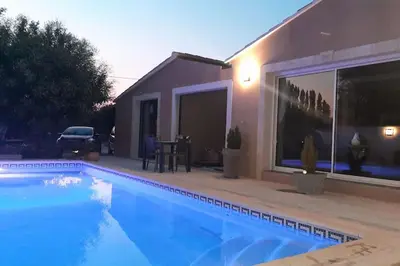 a swimming pool in front of a house at Maisonnette en campagne au calme in Carpentras