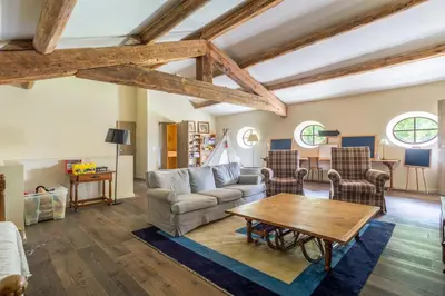 a living room with a couch and a table at Les Deux Mas in Lagnes