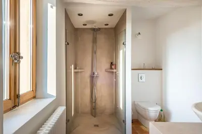 a bathroom with a shower and a toilet at Maison Sebastien in Saint-Michel-lʼObservatoire