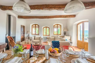 a living room with a table with fruit on it at Maison Sebastien in Saint-Michel-lʼObservatoire