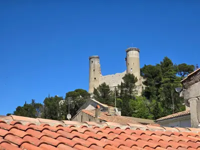 a building with two towers on top of roofs at Pic love, 2 personnes jacuzzi in Châteaurenard