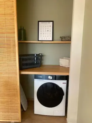 a microwave sitting on a shelf in a room at Gîte Un air de Provence in Eyguières