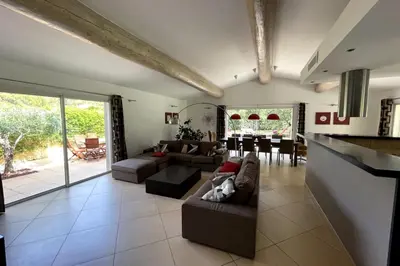 a living room with a couch and a table at Villa Oasis Luxury and Relaxation in Provence in Lambesc