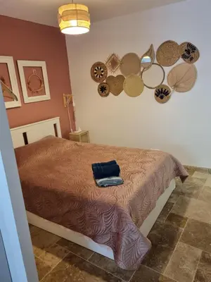 a bedroom with a bed and some plates on the wall at Harmonie in Monteux