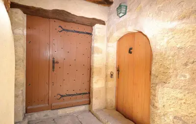two wooden doors in a stone building at 1 Bedroom Lovely Home In Viens in Viens