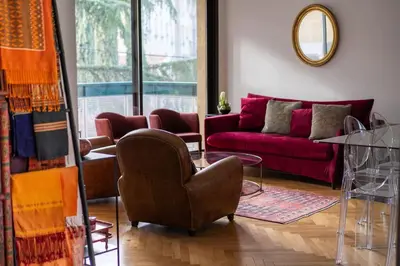 a living room with a couch and a chair at T3 Centre ville Aix-en-Provence in Aix-en-Provence