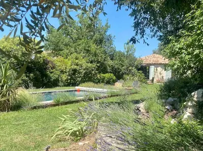 a garden with a swimming pool in a yard at Charmante dépendance avec piscine en Provence in Le Puy-Sainte-Réparade