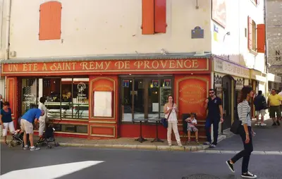 people are standing outside of a store on a street at Amazing Home In Saint Remy De Provence in Saint-Rémy-de-Provence