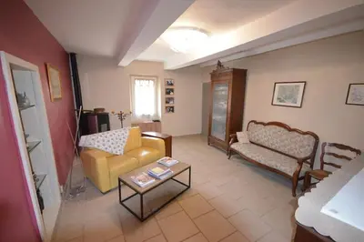 a living room with a couch and a table at La maison d'Anthonie, Roussillon in Roussillon