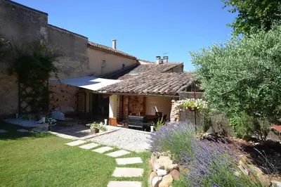a backyard of a house with a garden at La maison d'Anthonie, Roussillon in Roussillon