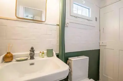 a bathroom with a sink and a toilet at Petit Cocon avec Vue Dernier Etage - Mazarin 1833 in Aix-en-Provence
