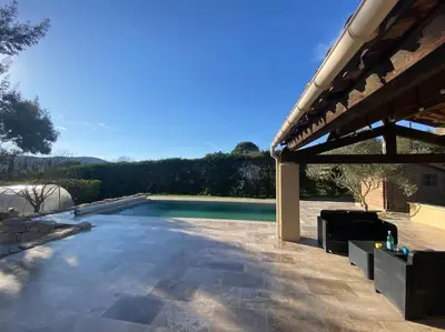 a swimming pool with a pavilion next to at La villa Li Grihet in Beaumont-de-Pertuis