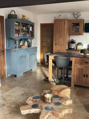 a kitchen with a table and a counter with a tableablish at Lou Jasset in Cabrières-dʼAigues