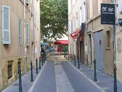 an empty street in an alley between two buildings at Studio, Aix centre historique in Aix-en-Provence