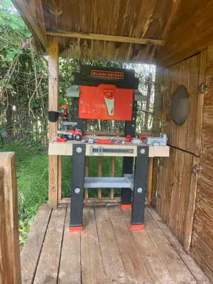 a table with a sewing machine on a wooden deck at Appartement in Caumont-sur-Durance