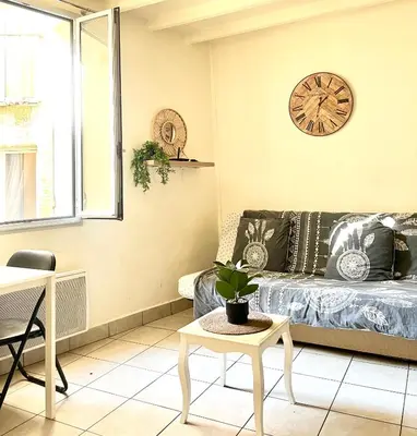 a kitchen with a counter with a sink and a microwave at Studio cœur de ville avec salle de bain privative & kitchenette in Carpentras