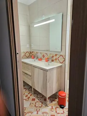 a bathroom with a sink and a mirror at Maison en Provence avec piscine in Sainte-Tulle