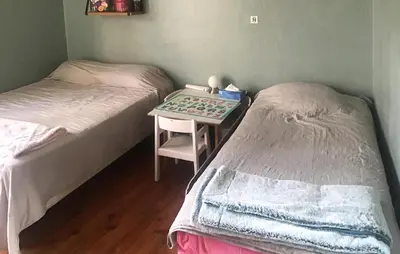 a room with two beds and a table with a tray at Nice Home In Entraigues-Sur-La-Sorg in Entraigues-sur-la-Sorgue