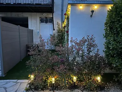 a garden with lights in front of a house at Détours en Provence - Lavande 3* in Châteaurenard