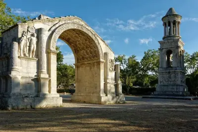 an arch and a statue in a park at Détours en Provence - Lavande 3* in Châteaurenard
