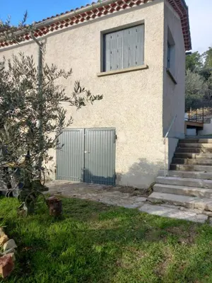 a house with a gate and a window at La Grange de Paulette in Bédoin