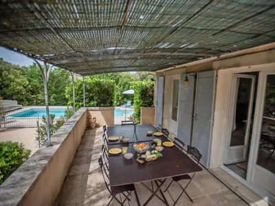 a patio with a table with food on it at La Cadeline in Saumane-de-Vaucluse