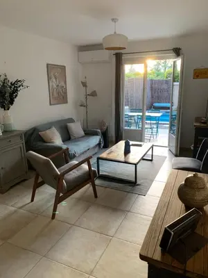 a living room with a couch and a table at Maison de charme à Lourmarin in Lourmarin