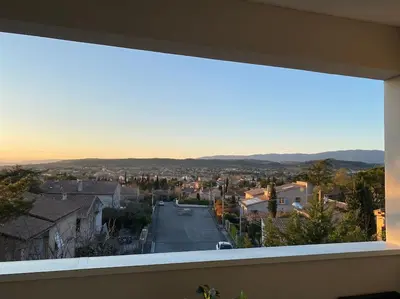 a view of a city from a window of a building at Beau Duplex climatisé T3 vue panoramique Luberon in Pertuis