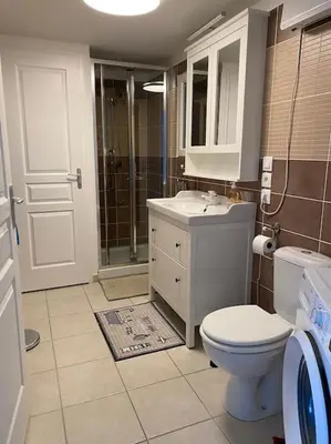 a bathroom with a toilet and a sink and a shower at Beau Duplex climatisé T3 vue panoramique Luberon in Pertuis