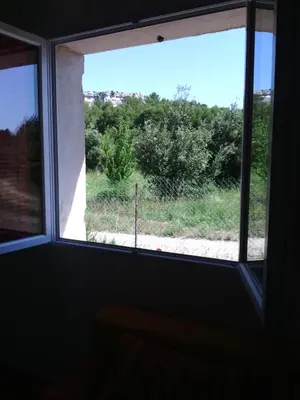 a window in a room with a view of a field at Le Pas des Lanciers in Mallemort