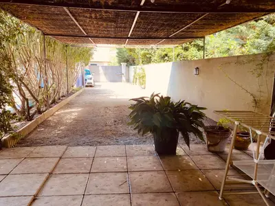 an empty patio with a potted plant on it at Maison AdriAnna in Vedène