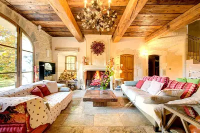 a large living room with couches and a fireplace at Villa élégante à Lambesc avec spa in Lambesc