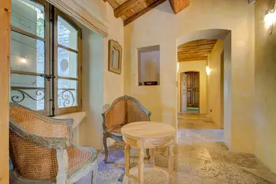 a room with a table and chairs and a window at Villa élégante à Lambesc avec spa in Lambesc