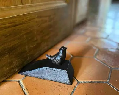 a figurine of a bird sitting on a block on a floor at Maison des Arts Aix en Provence Apartment in Aix-en-Provence