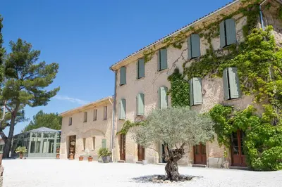 a building with a tree in front of it at Domaine Gao in Aix-en-Provence